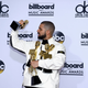 Drake poses in the press room with his many awards at the 2017 Billboard Music Awards at T-Mobile Arena on May 21, 2017, in Las Vegas.